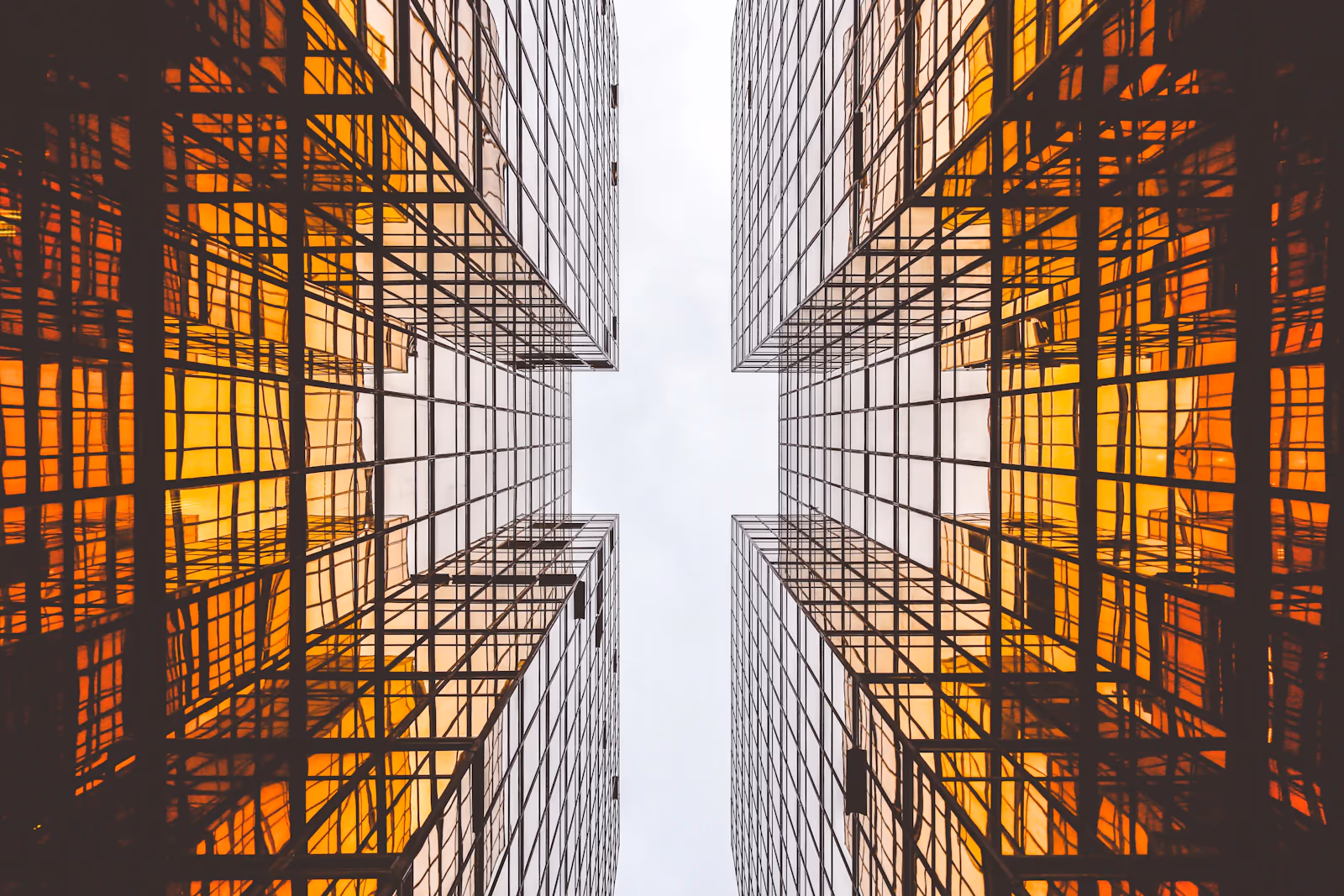 Twin towers of amber glass, face to face